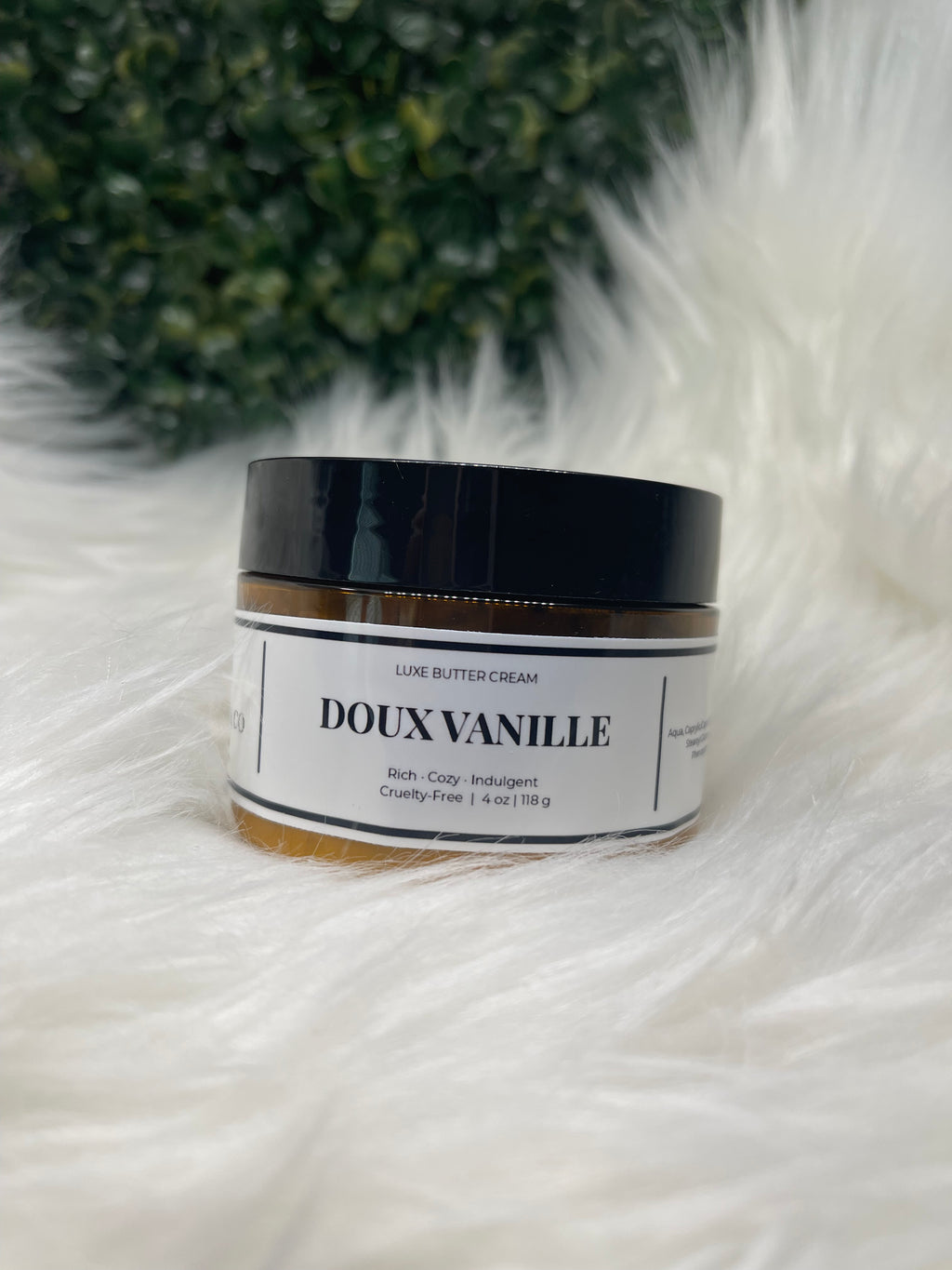 Jar of Douxvanille product on a white fur background