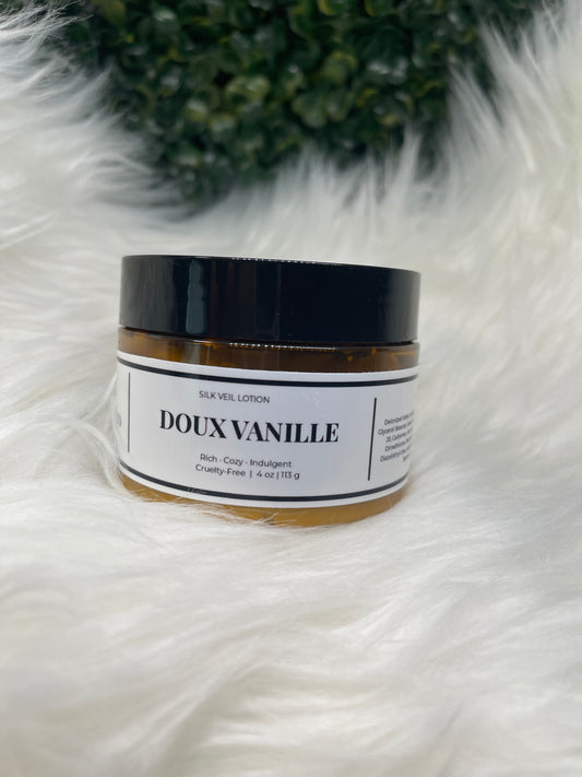 Cosmetic jar with 'DOUX VANILLE' label on a white fur surface