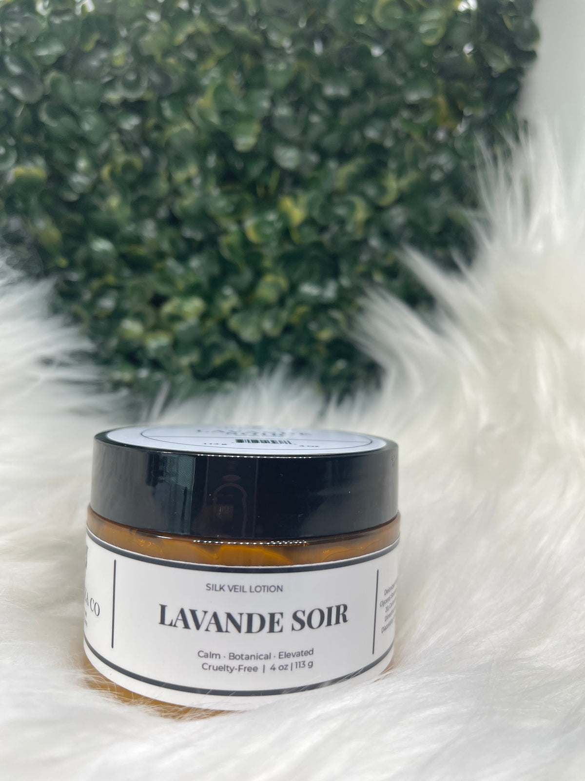 Jar of 'Lavande Soi' on a white background with greenery