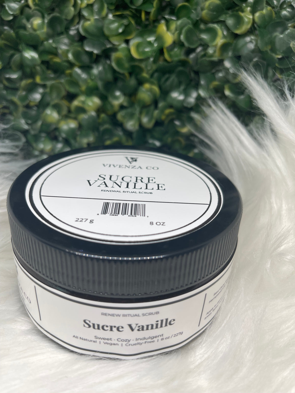 Jar of Sucre Vanille on a white background with greenery